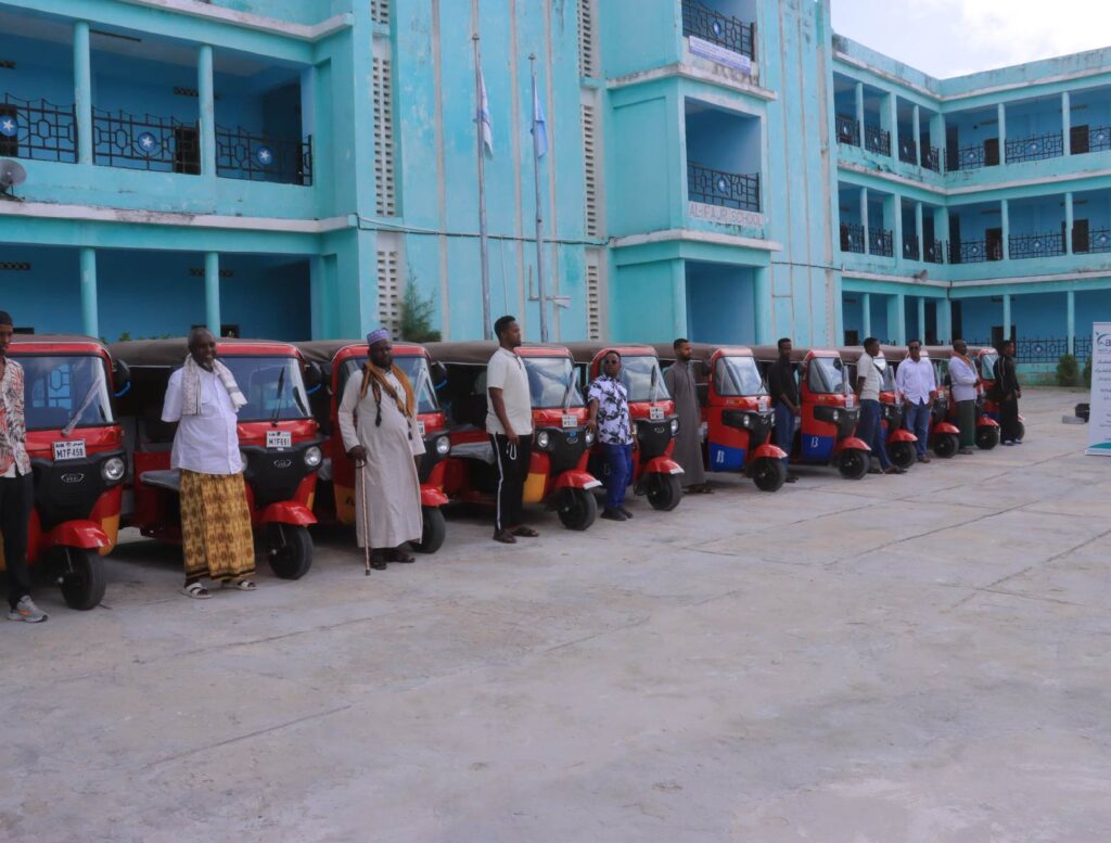 Red tuk-tuks provided through Kafi for Development's youth economic empowerment initiative in Mogadishu.