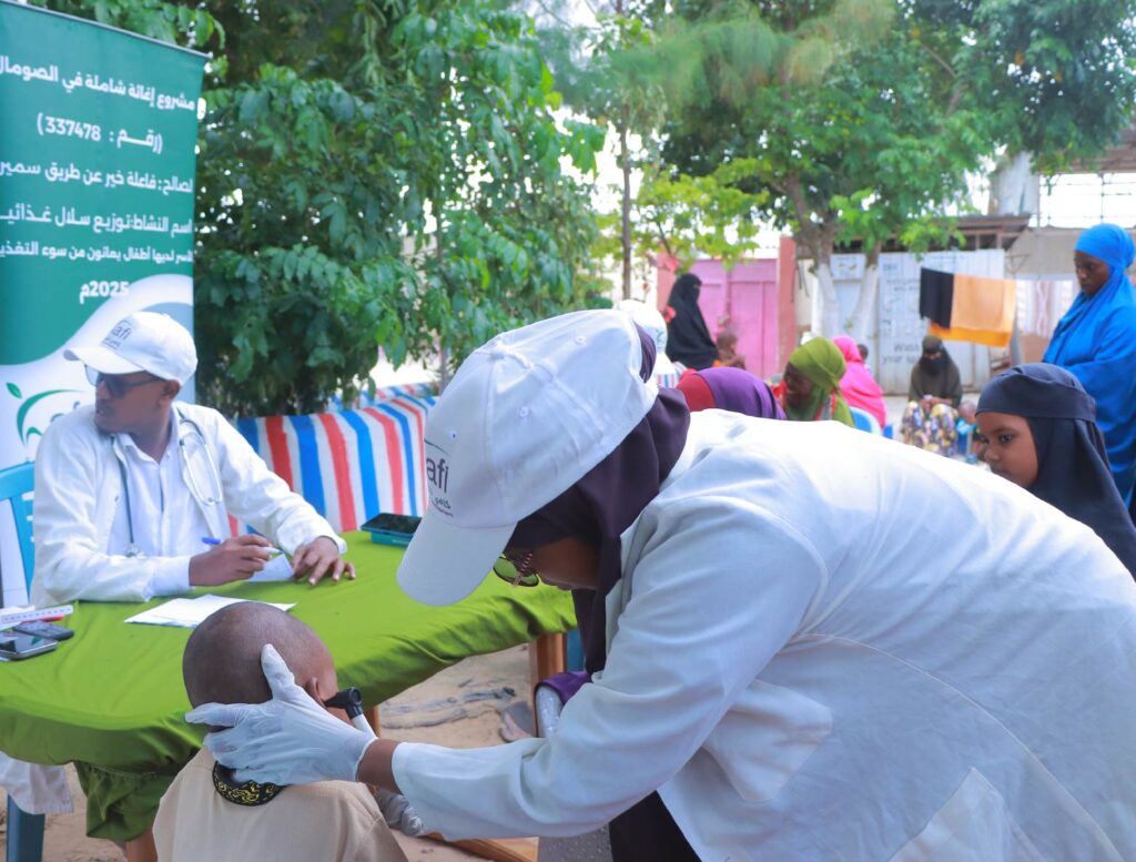 A health worker conducts a child health assessment during the initiative.