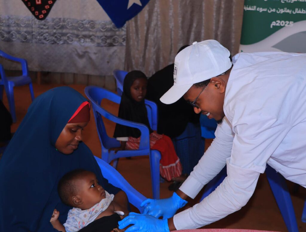 A health worker conducts a child health assessment during the initiative.